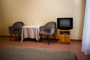 TV a/nebo společenská místnost v ubytování ACAPULCO