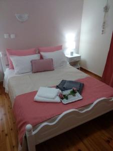 A bed or beds in a room at Vacations in Corfu-Antiperni by CorfuEscapes