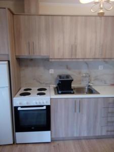 A kitchen or kitchenette at Vacations in Corfu-Antiperni by CorfuEscapes