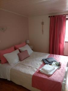 A bed or beds in a room at Vacations in Corfu-Antiperni by CorfuEscapes