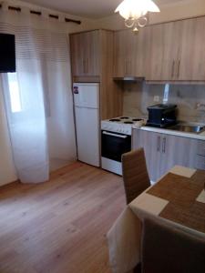 A kitchen or kitchenette at Vacations in Corfu-Antiperni by CorfuEscapes