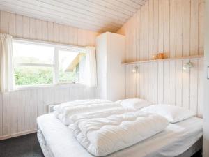 Postel nebo postele na pokoji v ubytování Holiday home Oksbøl XLVIII