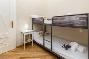 Postel nebo postele na pokoji v ubytování My Loft 4 You Gran Via