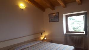 Ένα ή περισσότερα κρεβάτια σε δωμάτιο στο Casa Luisa