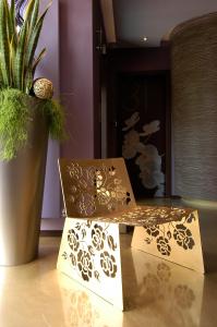 a box sitting on a table next to a potted plant at Les Fleurs Boutique Hotel in Sofia