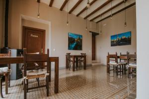 a room filled with wooden tables and chairs at Casa Etxalde in Camprodon