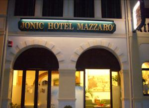 a jumeirah hotel masrakro with a sign on top of it at Jonic Hotel Mazzar&ograve; in Taormina