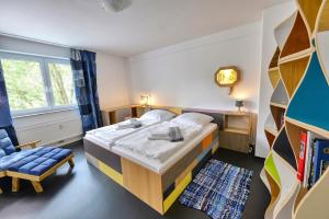 En eller flere senger på et rom på Hostel am Niederfeldsee