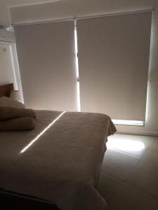 Кровать или кровати в номере Luz de Jacinta