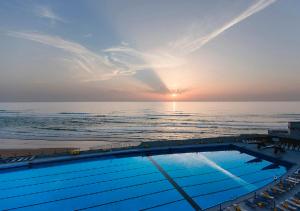 a swimming pool on a cruise ship with the ocean at Arribas Sintra Hotel in Sintra