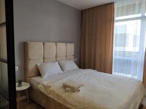 Ένα ή περισσότερα κρεβάτια σε δωμάτιο στο VIP Apartments on Avalon
