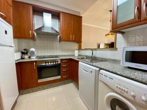 a kitchen with a dishwasher and a washer and dryer at CHURRUCA 3 in Vigo