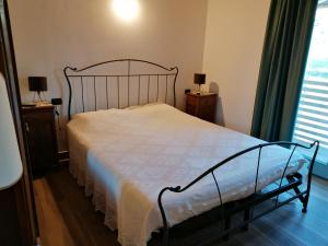 A bed or beds in a room at Az. Agr. Sponga Giancarlo