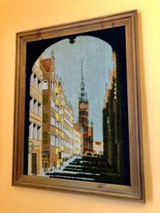 a picture of a painting of a city at Bielski Lawendowa Rooms in Gdańsk
