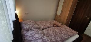 Posteľ alebo postele v izbe v ubytovaní Ohana Wellness apartman