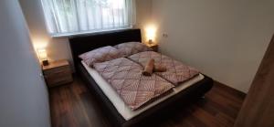 Posteľ alebo postele v izbe v ubytovaní Ohana Wellness apartman