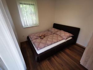 Posteľ alebo postele v izbe v ubytovaní Ohana Wellness apartman
