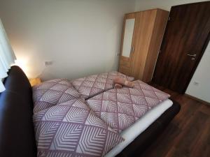 Posteľ alebo postele v izbe v ubytovaní Ohana Wellness apartman
