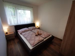 Posteľ alebo postele v izbe v ubytovaní Ohana Wellness apartman