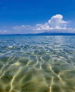 a large body of water with rocks in it at SimOtel Ermis in Hanioti