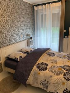 En eller flere senge i et værelse på VILLA ROMANA