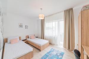 Un pat sau paturi într-o cameră la Casa Zorilor Cluj