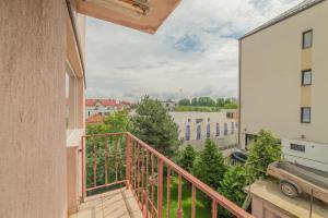 a balcony with a view of a building at Casa Zorilor Cluj in Cluj-Napoca