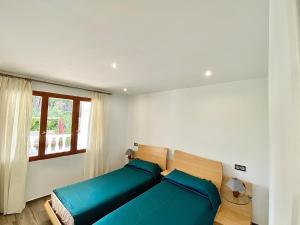 Postel nebo postele na pokoji v ubytování Apartamento en el centro del Albir + 28 fotografií