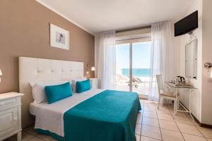 Postel nebo postele na pokoji v ubytování Hotel Soraya - Spiaggia Sawasdee with Beach & Parking