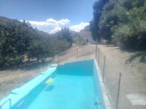 an overhead view of a swimming pool in a field at Casa Gelferraro in Calatafimi