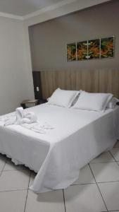 Postel nebo postele na pokoji v ubytování Hotel Ravenna