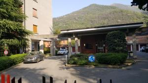 a car parked in a parking lot next to a building at Civico 17 in Canzo