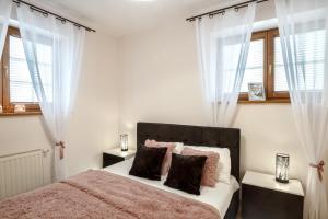 Postel nebo postele na pokoji v ubytování Apartamenty Tatrzańskie Turnie