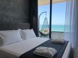 Postel nebo postele na pokoji v ubytování Mirage Hotel