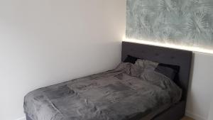 Llit o llits en una habitació de Apartament Holiday - Centrum