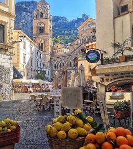 a street with baskets of fruit on a city street at Holiday House D' Anna 68 in Agerola