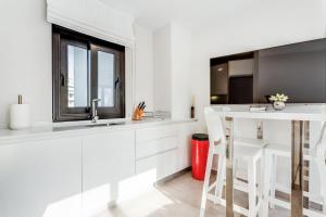 A kitchen or kitchenette at by RIVA - Chic, Contemporary Studio in Puerto Banus Gardens