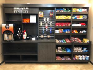 a cashier counter in a store with food at Candlewood Suites - Panama City Beach Pier Park, an IHG Hotel in Panama City Beach