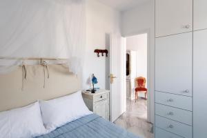 Posteľ alebo postele v izbe v ubytovaní Ricos Two Bedroom House - Naoussa Paros