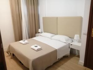 Кровать или кровати в номере bellaria