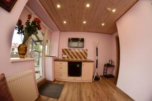 a kitchen with pink walls and a counter top at Vila Venecija in Palanga