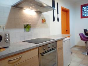 a kitchen with a sink and a stove top oven at La clef de bois in Braine-le-Comte +15 photos