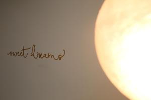 a cup of coffee with the words not dreaming at Under the Aqueduct boutique house in Kavála