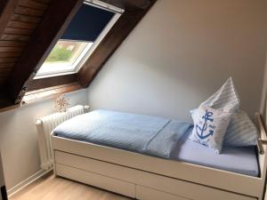 
Ein Bett oder Betten in einem Zimmer der Unterkunft Noord Huus Ferienapartment
