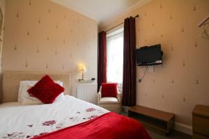 Postel nebo postele na pokoji v ubytování Dunallan Guest House