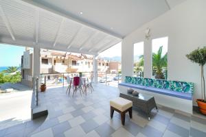 a living room with a view of the ocean at Golden Beachside terrace in Chrysi Ammoudia
