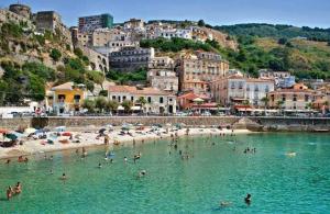 a group of people in the water at a beach at Nice Home Pizzo in Pizzo