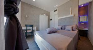 A bed or beds in a room at Vigna Caracciolo