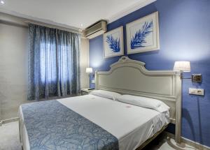 Postel nebo postele na pokoji v ubytování Hotel Rosa