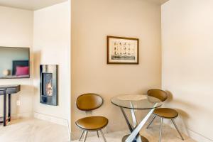 a dining room with a table and two chairs at Entrada Casita with a View in St. George